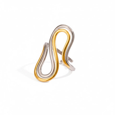 Mixed metal two-tone drift ring gold and silver sculptural band.