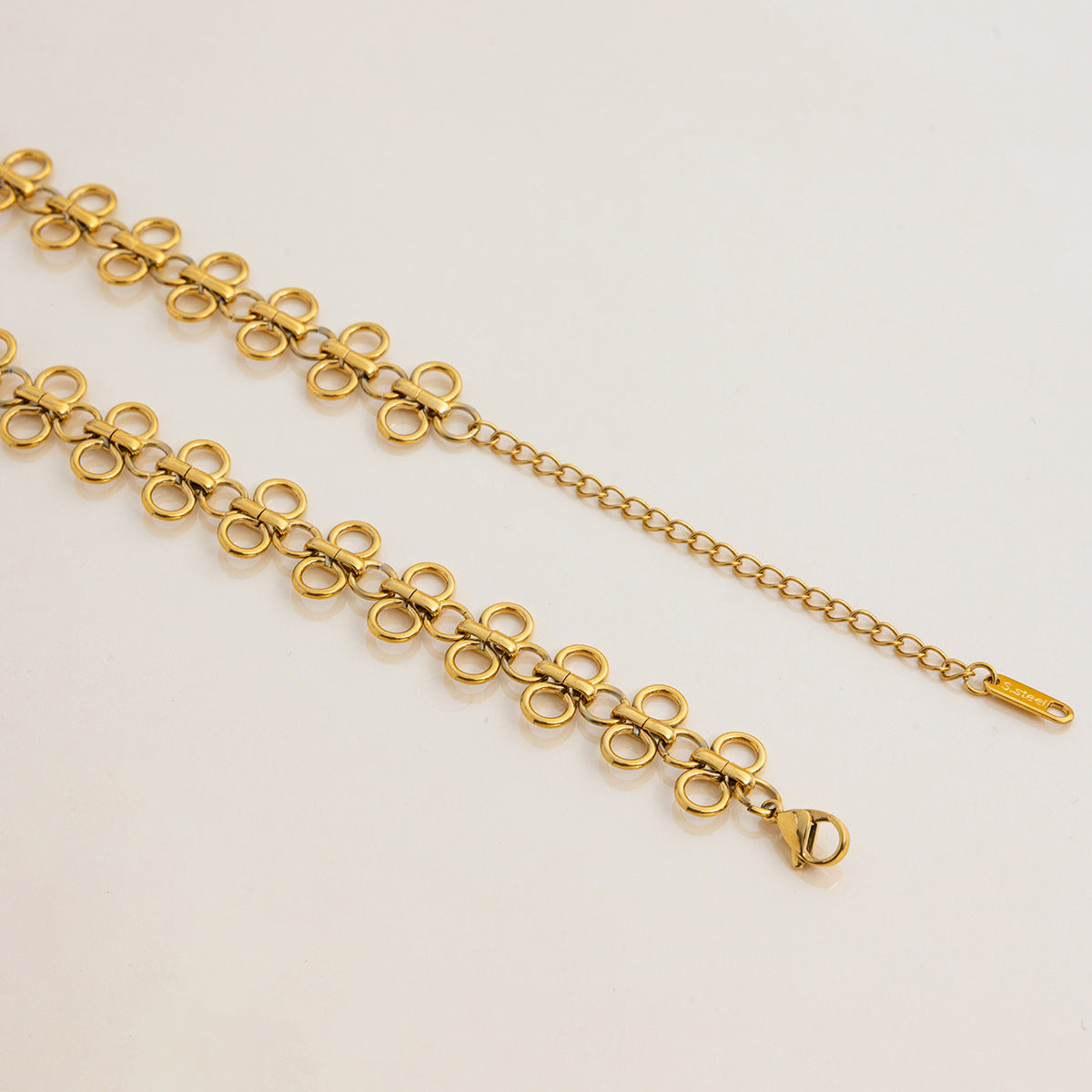 A close-up of the adjustable extender chain and secure lobster clasp on The Elodie Choker, showing the quality craftsmanship.