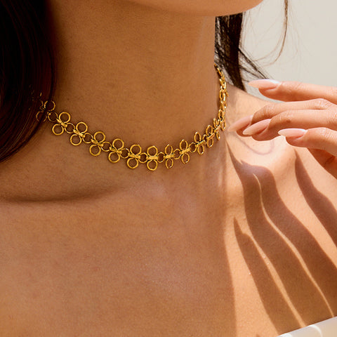 A model wearing The Elodie Choker with her hair swept back, demonstrating its delicate and feminine charm as an everyday lucky charm.