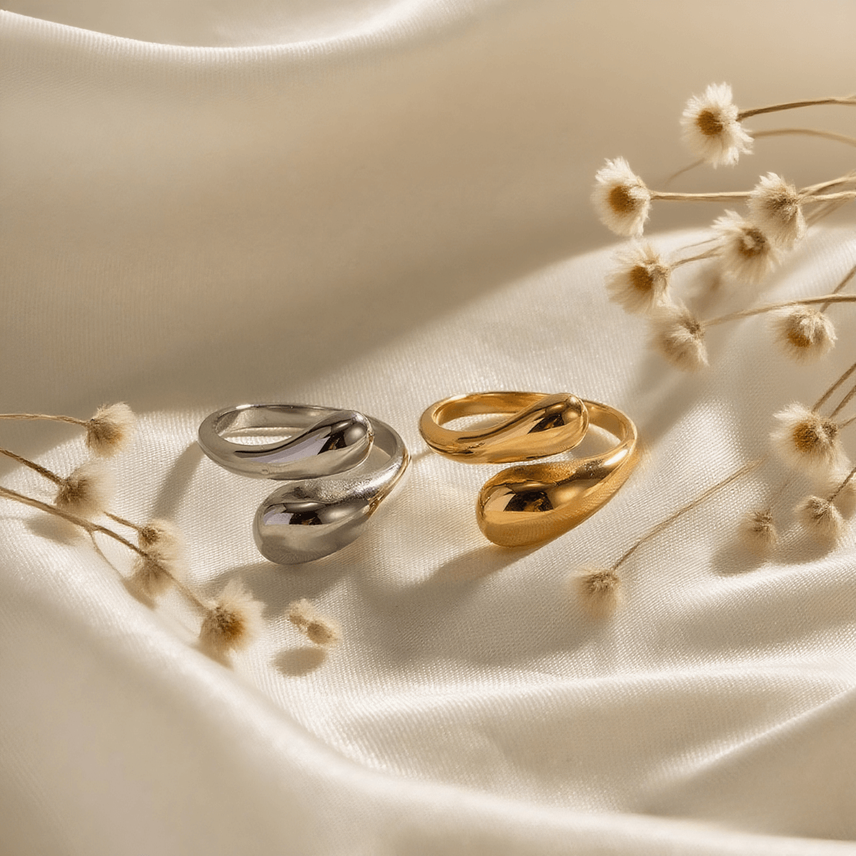 Fluid Pebble Ring — sculptural adjustable pebble wrap ring in gold/silver finish, waterproof and safe for sensitive skin.