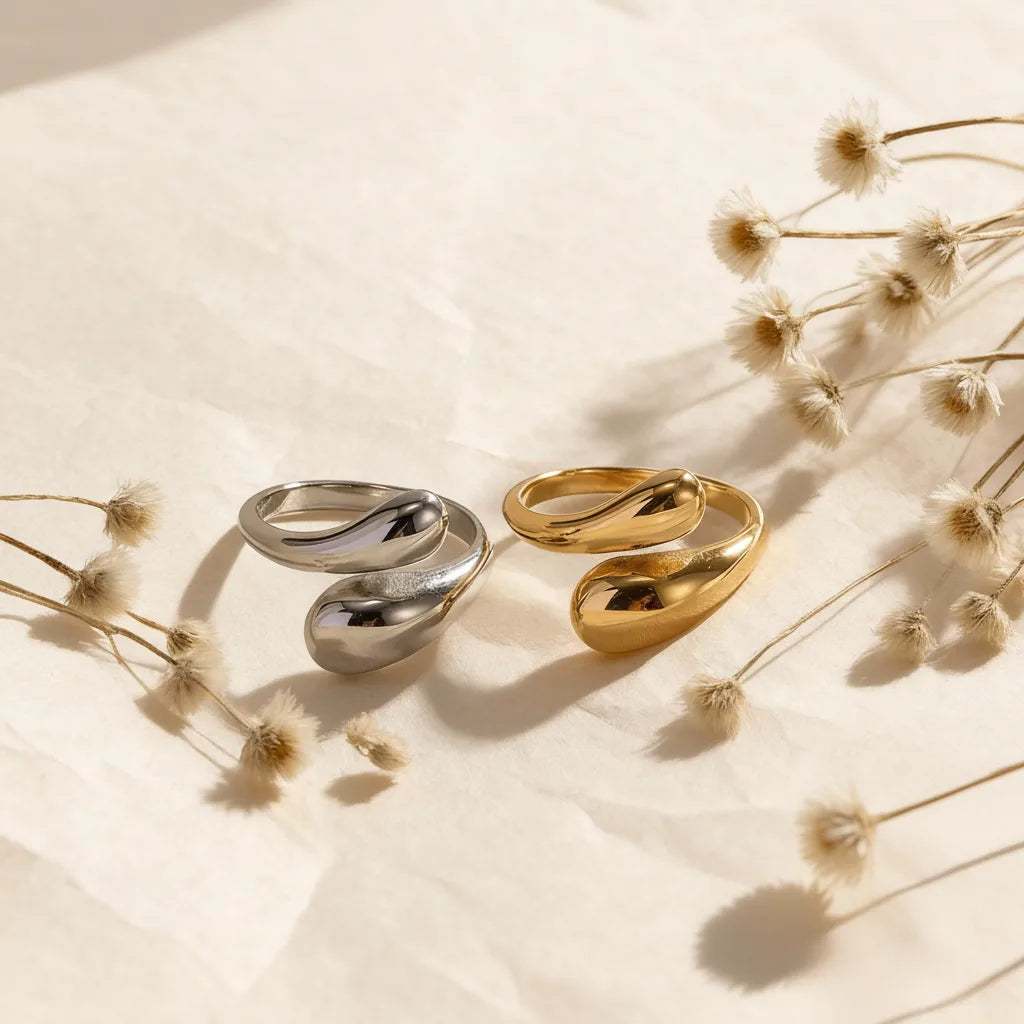 The two-tone and all-gold Fluid Pebble Rings displayed side-by-side, illustrating the versatile styling choices of this unique, artistic ring.