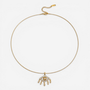 Gold evil eye necklace with crystal teardrop charms, waterproof stainless steel chain.