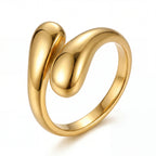 Gold bypass ring with sculptural double teardrop design waterproof stainless steel.