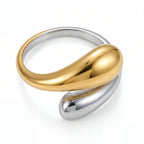Two-tone mixed metal open ring with gold and silver teardrop ends adjustable band.