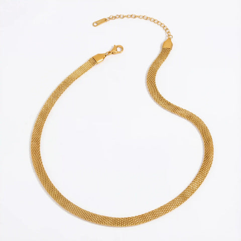 Gold mesh chain necklace flat flexible stainless steel choker on white background.