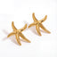 Pair of chunky gold starfish stud earrings waterproof stainless steel jewelry.