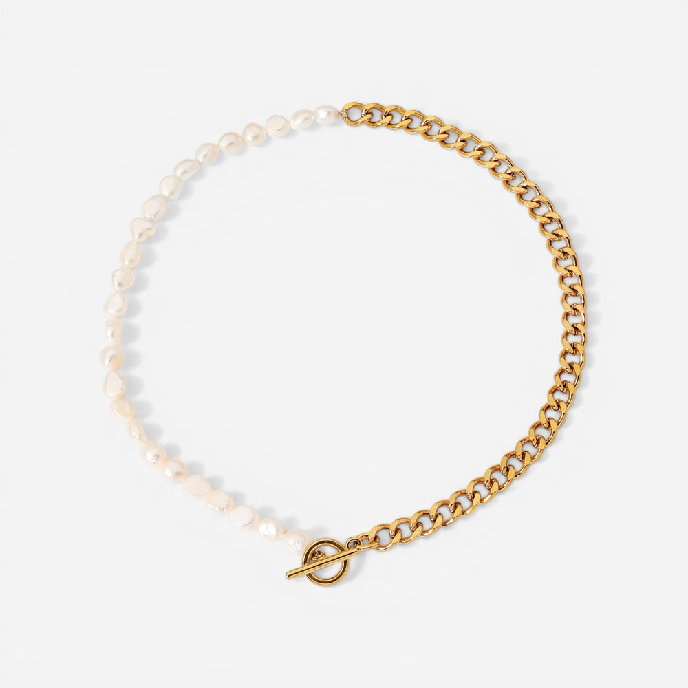Asymmetrical pearl and gold curb chain necklace with front toggle clasp waterproof jewelry.