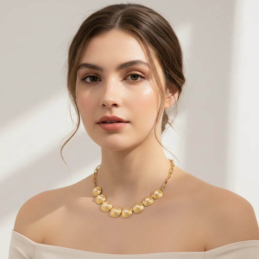 A stunning portrait of a model wearing The Hera pearl collar, embodying a regal and powerful queenly aesthetic perfect for a special occasion.