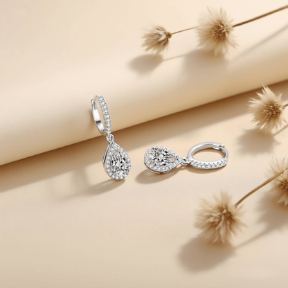 Luminous Drop Moissanite Earrings — teardrop moissanite stud earrings in sterling silver, graceful and radiant.