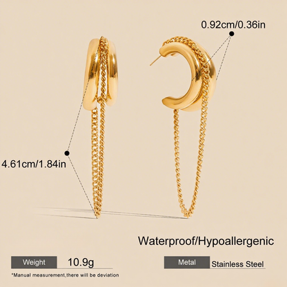 Luxe Layered Chain Hoops in 18K gold featuring a triple-stacked chunky C-shape design with a hanging curb chain on a white background.
