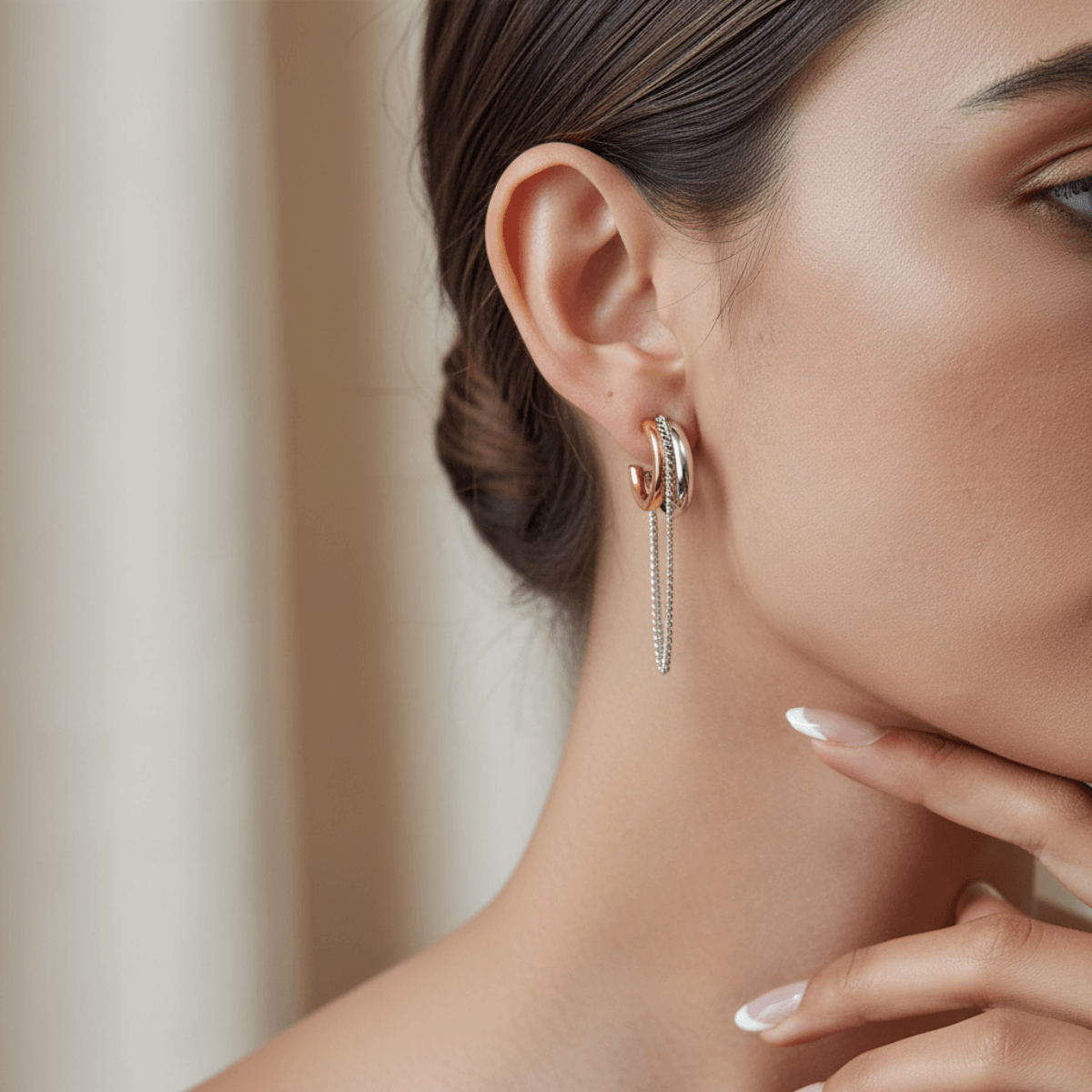 Model wearing the two-tone Luxe Layered Chain Hoops, paired with a black silk blouse to showcase the statement design.
