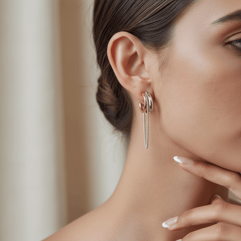 Model wearing the two-tone Luxe Layered Chain Hoops, paired with a black silk blouse to showcase the statement design.