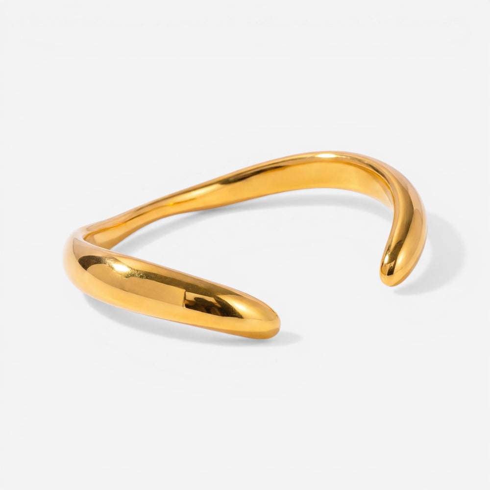 Gold organic wave open cuff bracelet waterproof stainless steel liquid metal design.