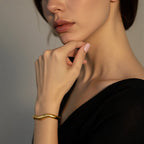 Minimal Wave Open Bangle — sculptural wave curve cuff bracelet in gold or dual-tone, elegant stacking piece.