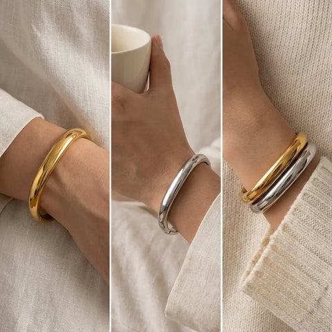 Fashion mood board of stacking gold and silver square cuffs with cozy sweater.