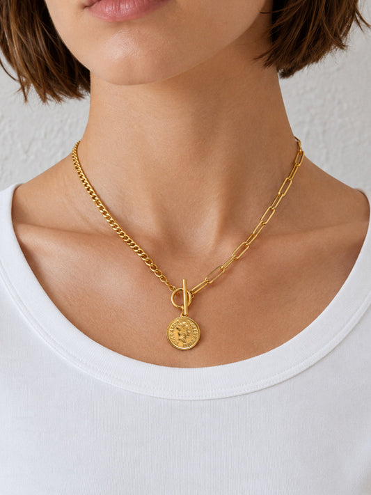 Model wearing Mixed Chain Coin Toggle Necklace with coin pendant at the collarbone