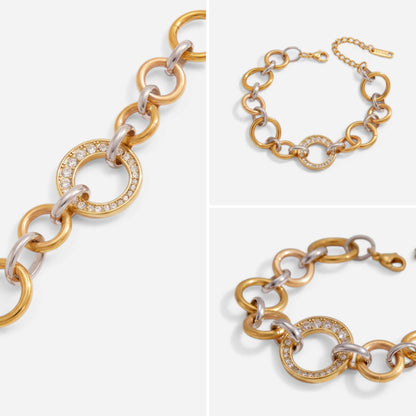 Aesthetic flat lay details of two-tone gold and silver link bracelet with pave crystal ring.