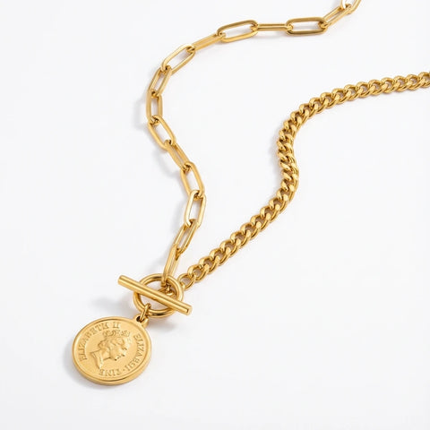 Asymmetrical gold chain necklace paperclip and curb link with queen coin pendant.