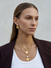 Gold coin pendant necklace styled with blazer and everyday outfit