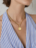 Mixed Chain Coin Toggle Necklace worn as part of a gold jewelry set