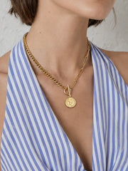 Mixed Chain Coin Toggle Necklace worn as part of a gold jewelry set