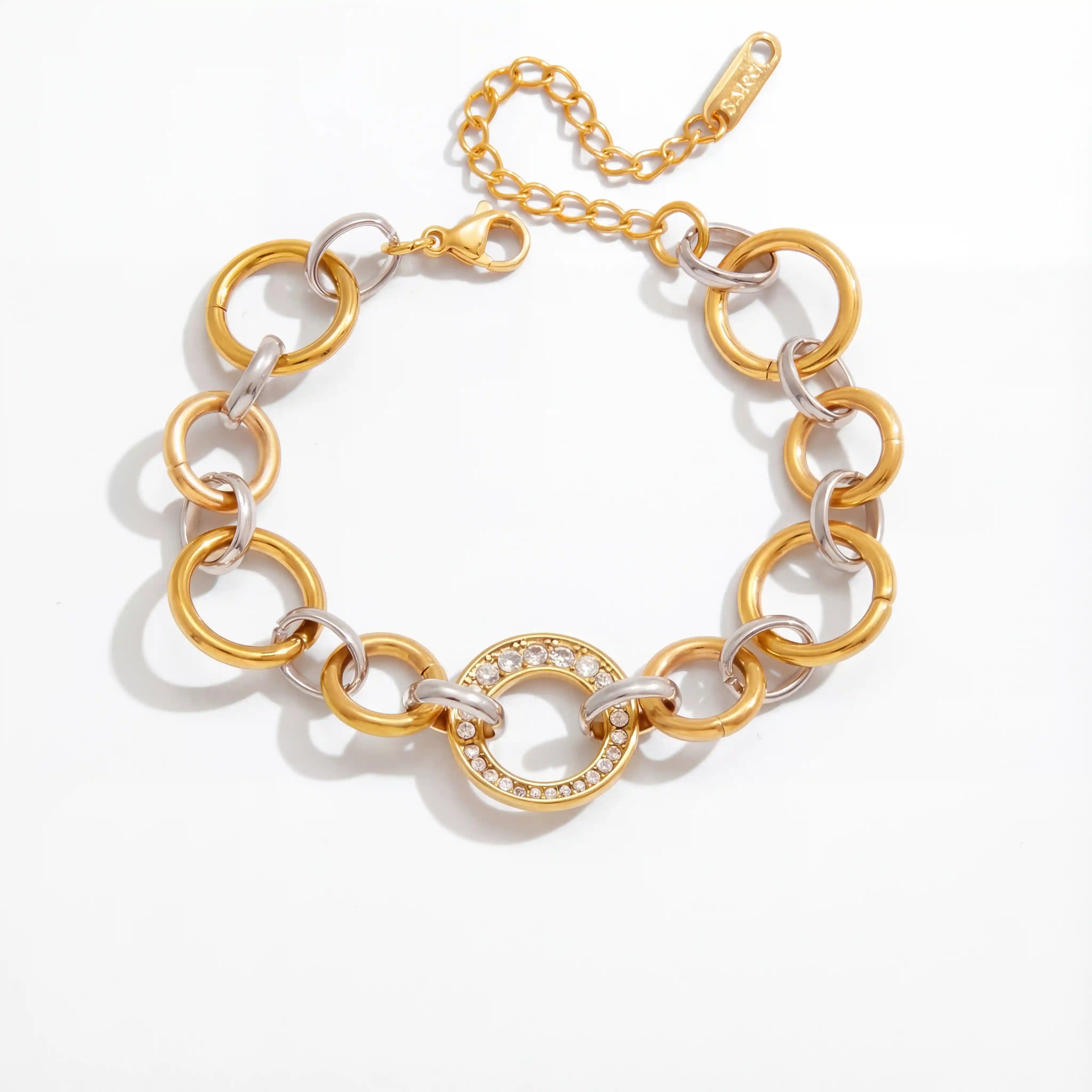Mixed metal interlocking link bracelet two-tone gold and silver waterproof stainless steel.