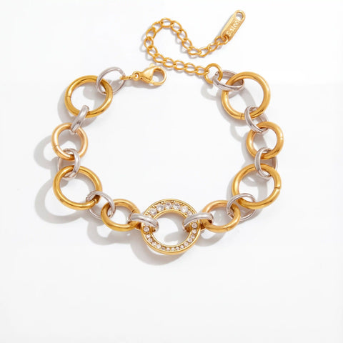 Mixed metal interlocking link bracelet two-tone gold and silver waterproof stainless steel.