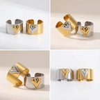 Aesthetic flat lay of matching mixed metal heart rings best friend jewelry set.
