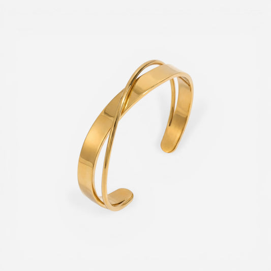 Modern crossover open cuff bracelet gold stainless steel intertwined design.