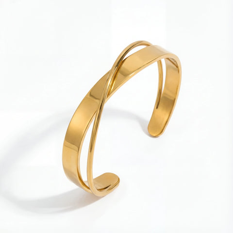 Modern crossover open cuff bracelet gold stainless steel intertwined design.