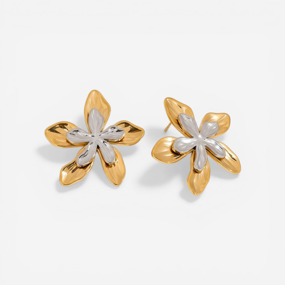 Mixed metal two-tone floral stud earrings gold and silver contrast design.
