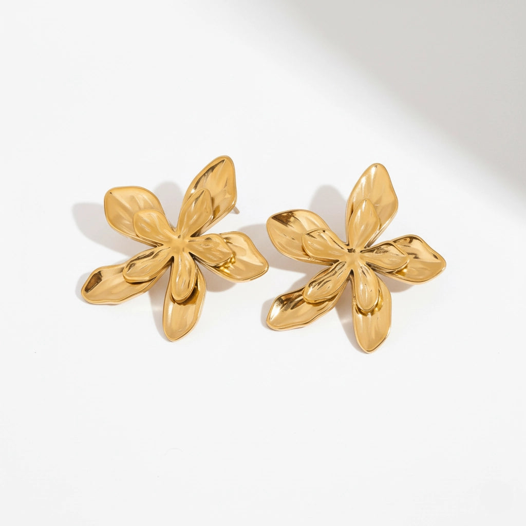 Pair of matte gold sculptural flower stud earrings waterproof stainless steel.