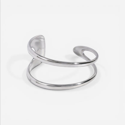Silver stainless steel geometric open cuff bracelet fluid design waterproof.