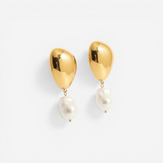 Pair of sculptural gold and white pearl drop earrings, waterproof stainless steel jewelry.