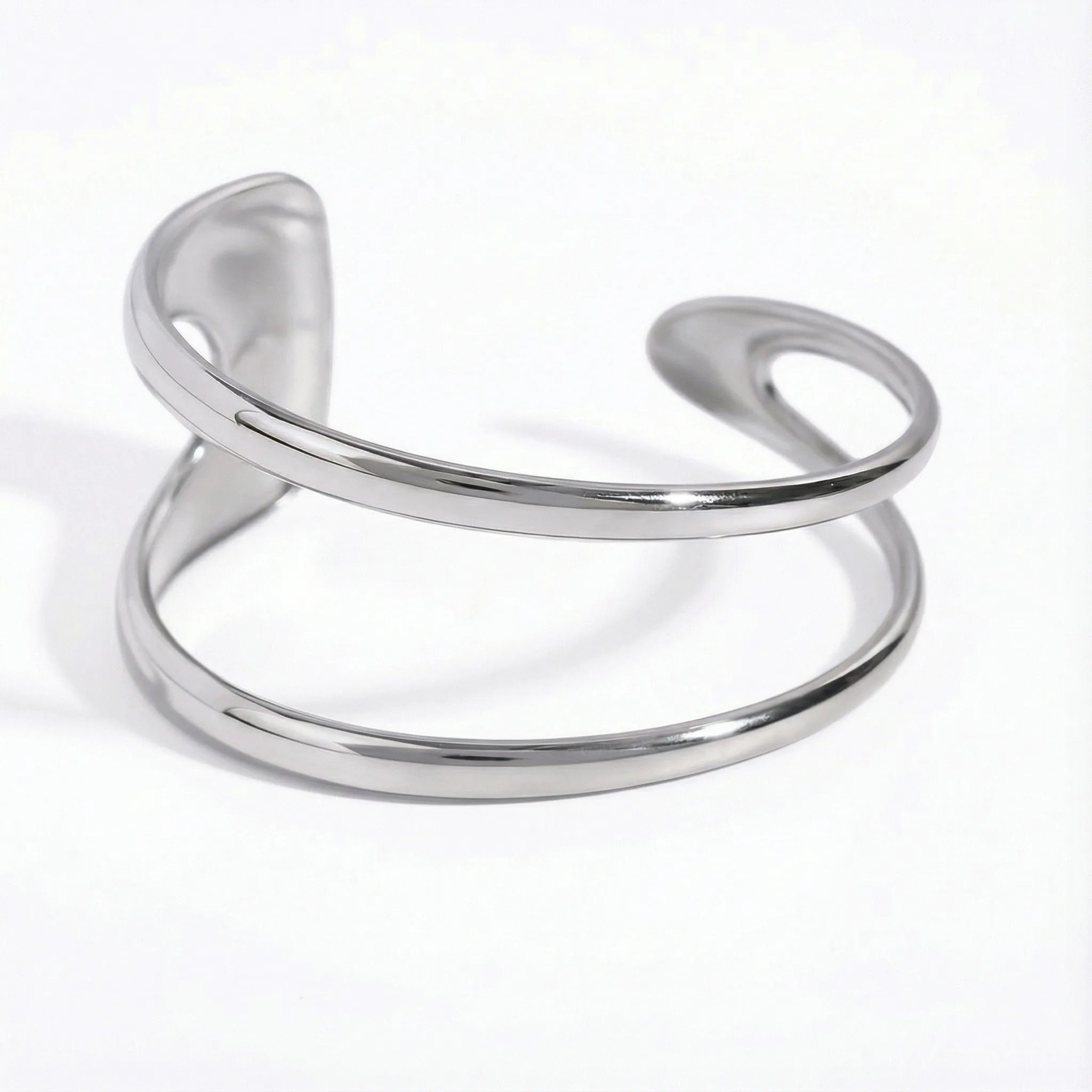 Silver stainless steel geometric open cuff bracelet fluid design waterproof.