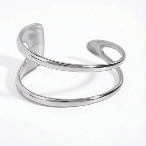 Silver stainless steel geometric open cuff bracelet fluid design waterproof.