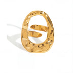 Abstract hollow oval statement ring gold hammered texture stainless steel.
