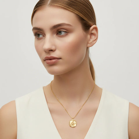 Minimalist styling of ancient coin relief zodiac necklace hypoallergenic stainless steel.