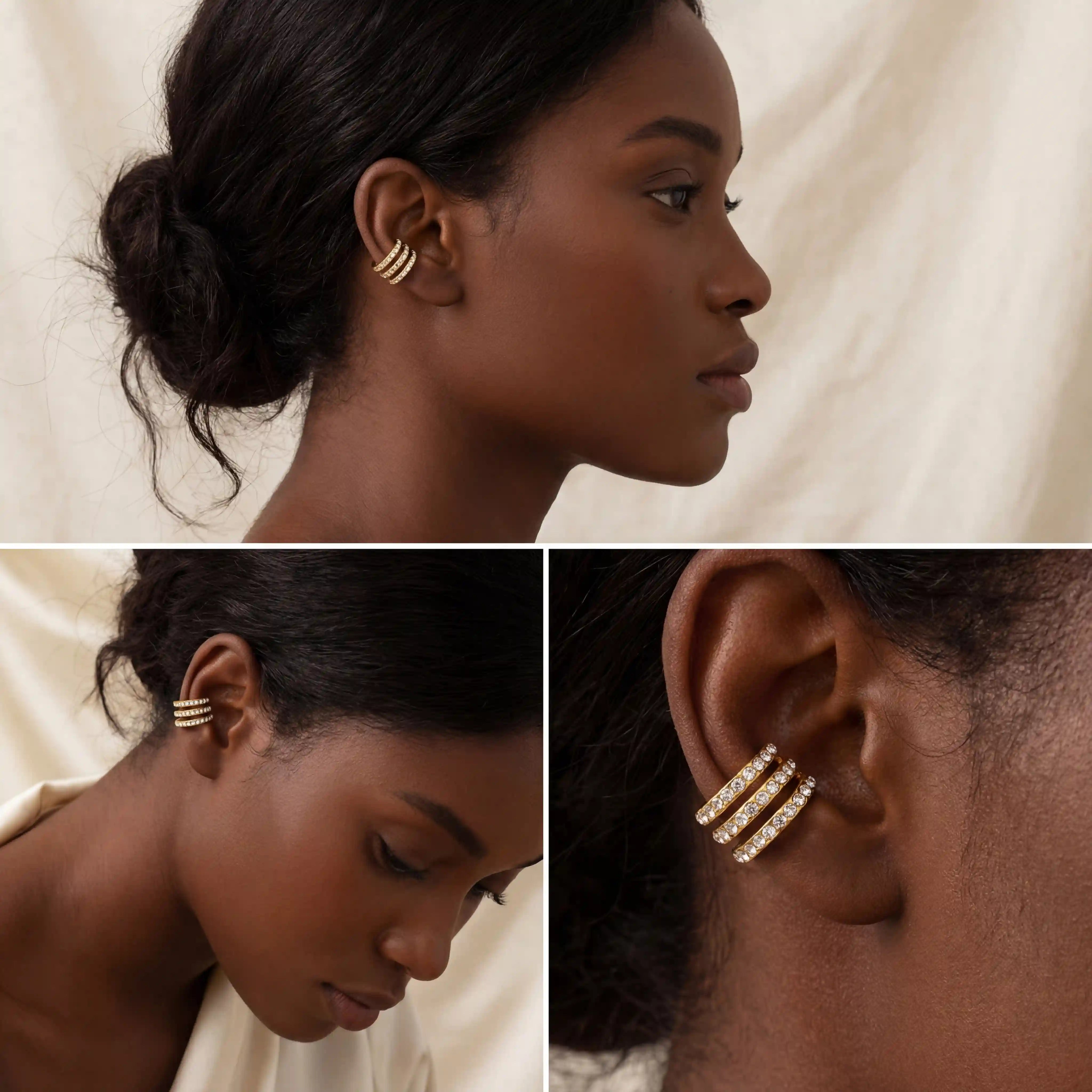 Dark skin model styling wide multi-row gold crystal ear cuff on cartilage.