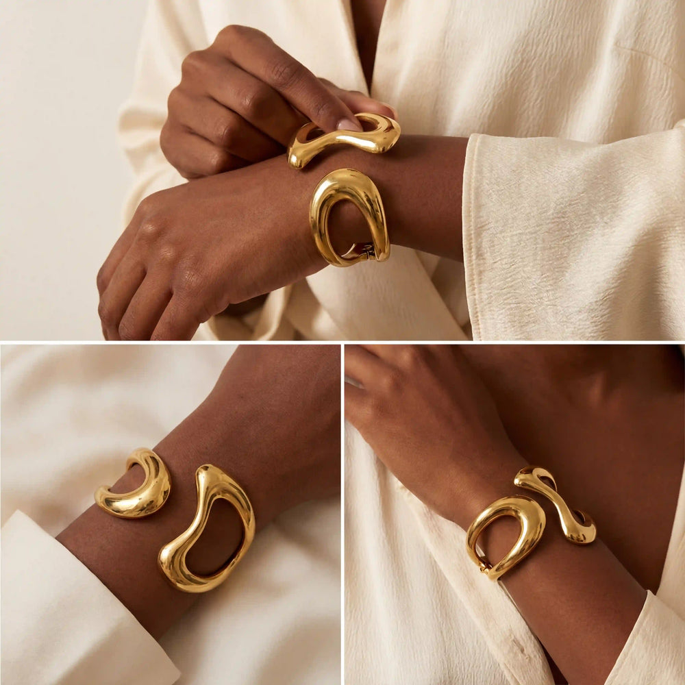 Model with dark skin styling abstract gold bangle bracelet with white shirt modern look.
