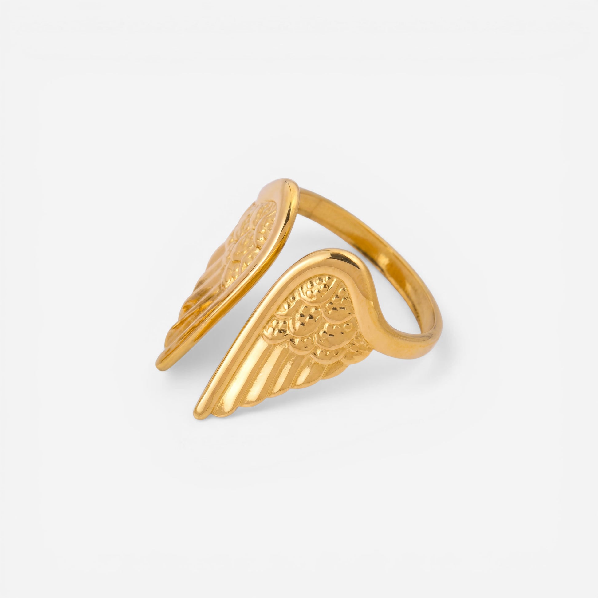 Two-tone silver and gold angel wing ring mixed metal adjustable statement band.