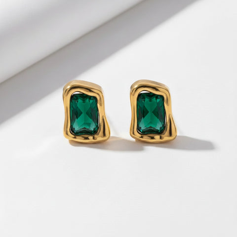 Emerald green gemstone rectangular stud earrings with textured gold setting.