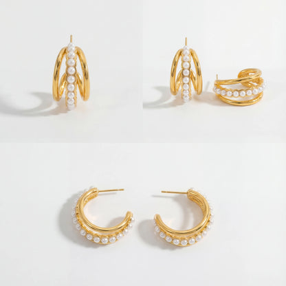Aesthetic product photography of triple layer pearl hoop earrings details on white background.