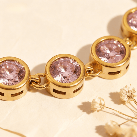 Sweetheart Pink Tennis Bracelet featuring round pink crystals in an 18k gold plated bezel setting, shown on a clean white background.