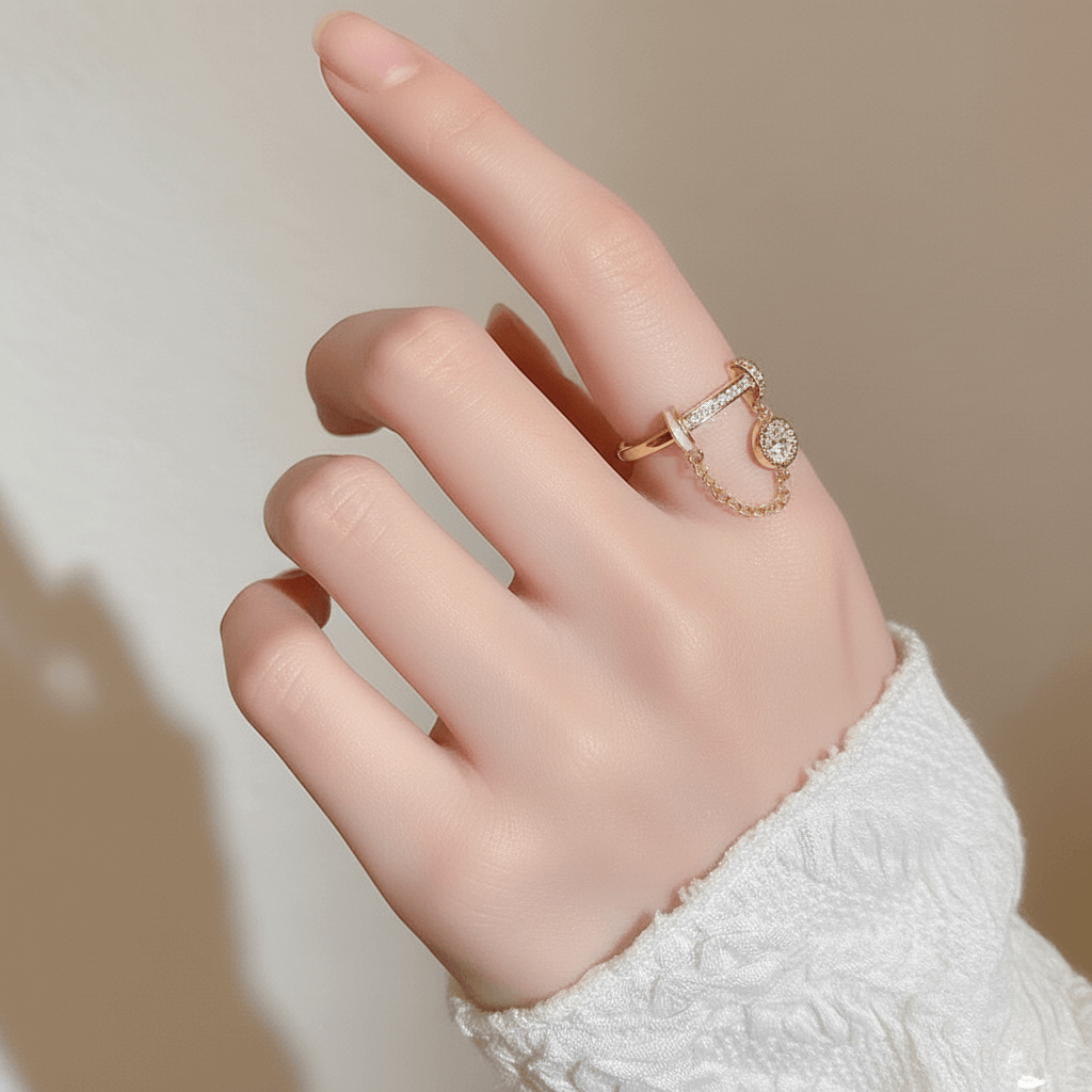 The Comet Ring lying on a vintage star chart or a piece of dark blue paper sprinkled with gold dust. This creative flat-lay directly connects the ring's design to its celestial, astronomical inspiration.