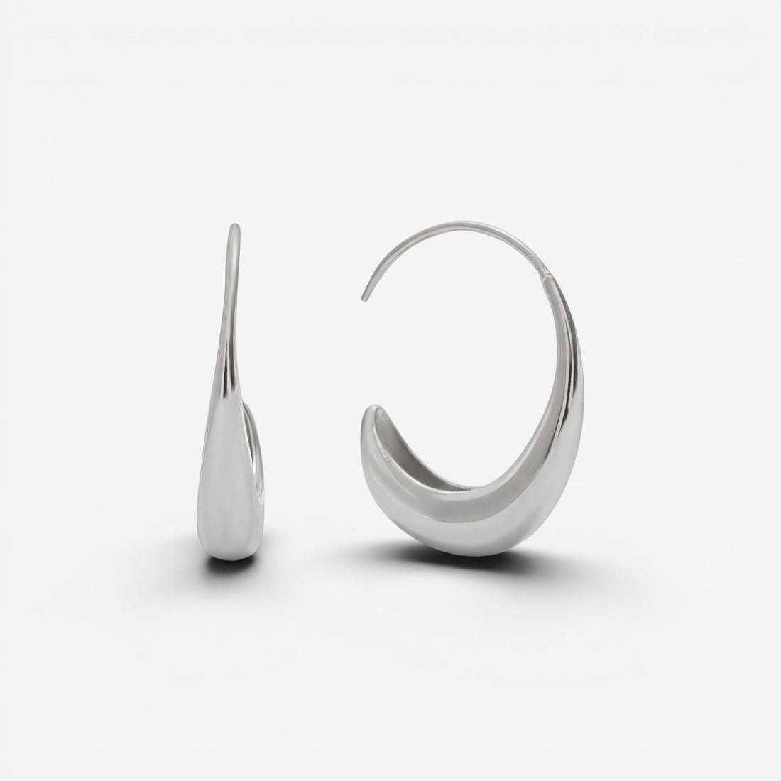 Silver teardrop earrings high polish stainless steel open hoop side view.