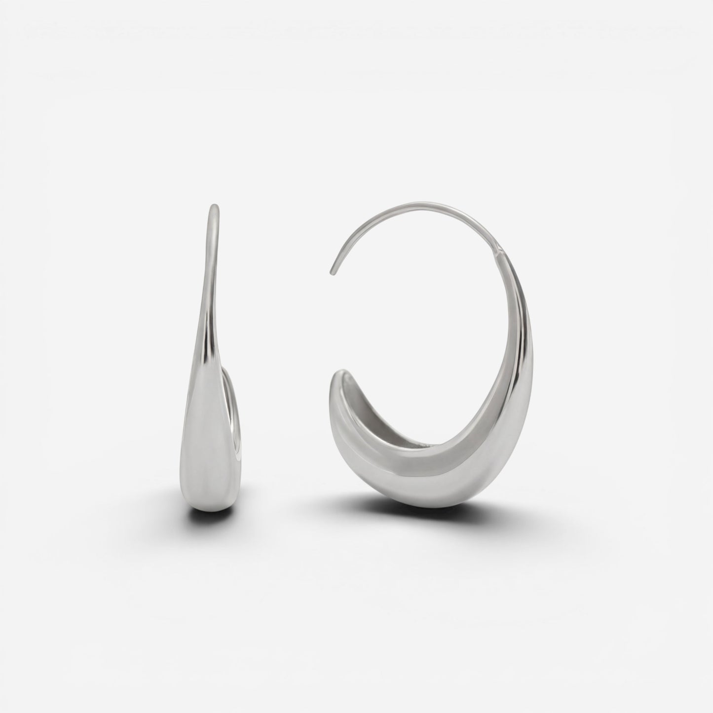 Silver teardrop earrings high polish stainless steel open hoop side view.