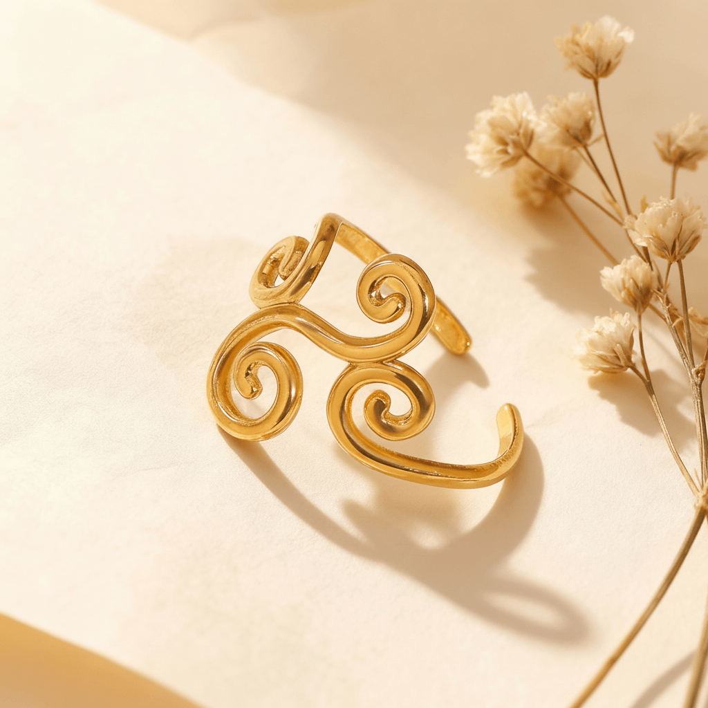 Sunlight streams across a model's hand, highlighting the intricate filigree cutouts and the high-polish finish of The Aphrodite Ring. The shot emphasizes the ring's delicate craftsmanship and ethereal quality.