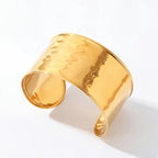 Wide gold hammered open cuff bracelet waterproof stainless steel.