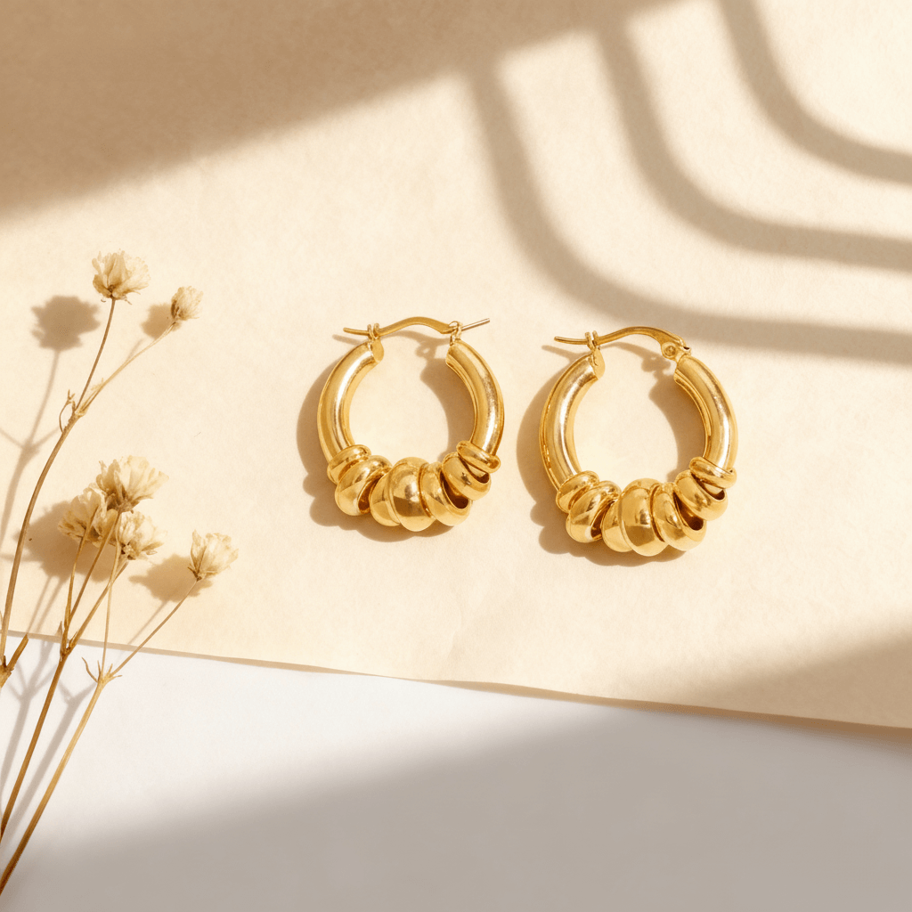 A pair of all-gold Siena Stacked Hoops, highlighting the textural, multi-ring design and high-shine 18K gold finish.